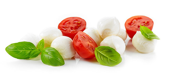Image showing Mozzarella cheese balls with tomato and basil