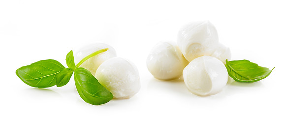 Image showing mozzarella cheese balls and basil leaves