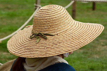 Image showing Woman wearing a traditional straw hat 
