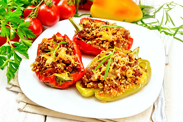 Image showing Pepper stuffed with meat and couscous in plate on board