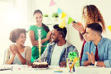 Image showing team greeting colleague at office birthday party