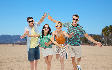 Image showing friends in sunglasses having fun on venice beach