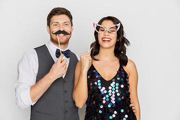 Image showing happy couple with party props having fun