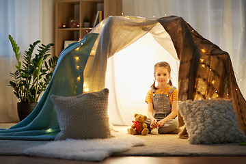 Image showing little girl with toys in kids tent at home