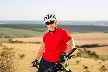 Image showing Portrait of Young Cyclist in Helmet and Glasses