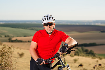 Image showing Portrait of Young Cyclist in Helmet and Glasses