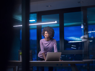 Image showing black businesswoman using a laptop in startup office