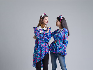 Image showing two Fashion Model girls isolated over white background