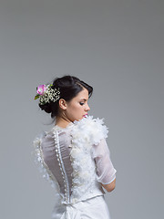 Image showing Rear view of a beautiful young woman in a wedding dress