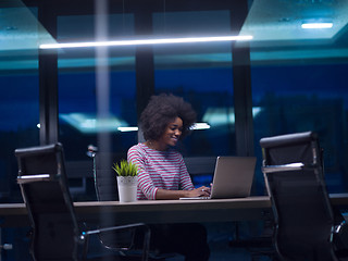 Image showing black businesswoman using a laptop in startup office