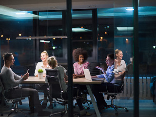 Image showing Multiethnic startup business team in night office