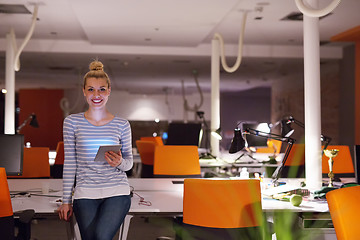 Image showing woman working on digital tablet in night office