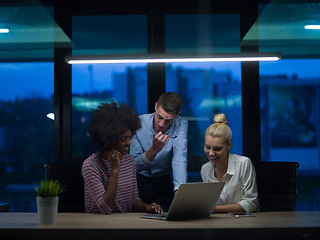 Image showing Multiethnic startup business team in night office