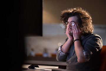 Image showing businessman relaxing at the desk