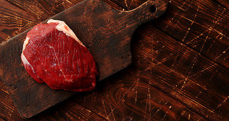 Image showing Raw meat on chopping board