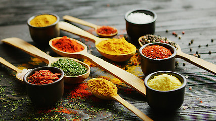 Image showing Bowls and spoons with spices