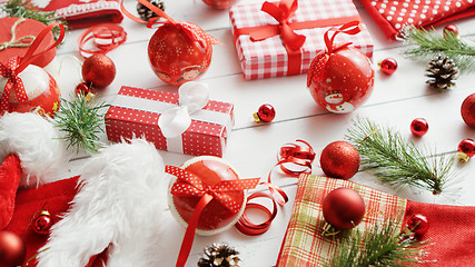 Image showing Conifer twigs and baubles near Christmas gifts