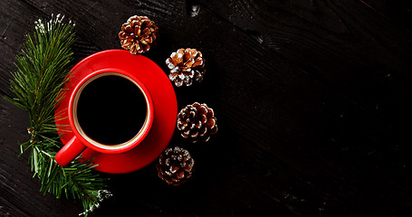 Image showing Cup of coffee and pinecones