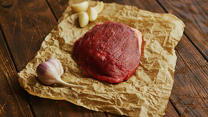 Image showing Garlic and meat on parchment