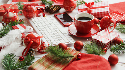 Image showing Christmas symbols around devices and hot beverage