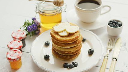 Image showing Pancakes with slices of banana and berries