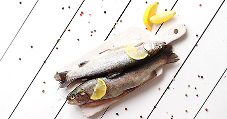 Image showing Lemon and pepper around fish