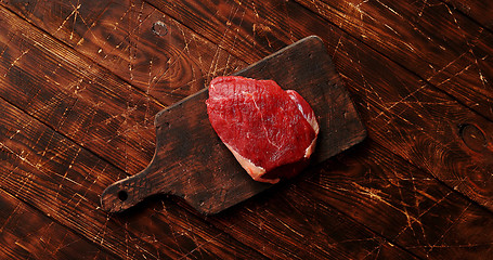 Image showing Raw meat on chopping board