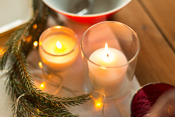 Image showing candles burning on christmas table