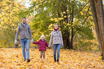 Image showing happy family walking at autumn park