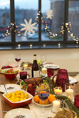 Image showing food and drinks on christmas table at home