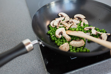 Image showing close up of food in frypan on cooking panel