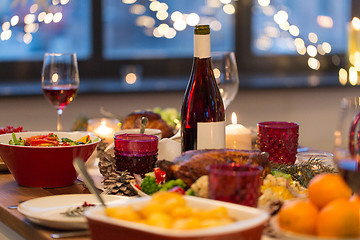 Image showing food and drinks on christmas table at home