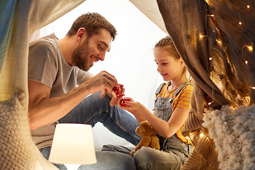 Image showing family playing tea party in kids tent at home