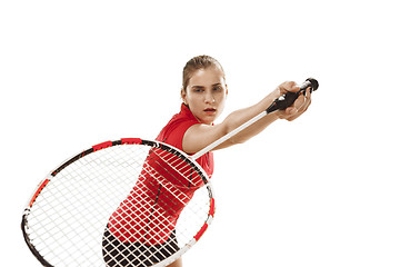 Image showing Young woman playing badminton over white background