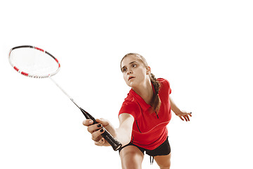 Image showing Young woman playing badminton over white background