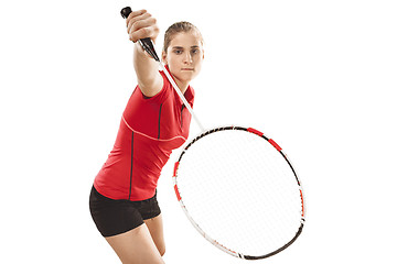 Image showing Young woman playing badminton over white background