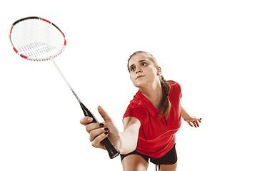 Image showing Young woman playing badminton over white background