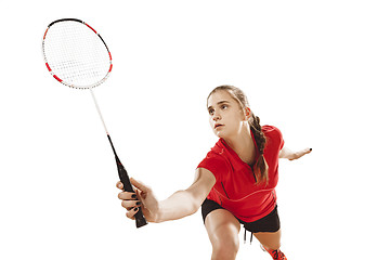 Image showing Young woman playing badminton over white background