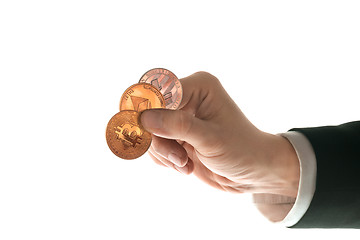 Image showing Male hand with golden bitcoin on white background