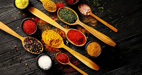 Image showing Set of spoons and bowls with spices