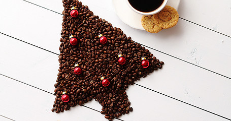 Image showing Beverage and cookies near Christmas tree from coffee beans