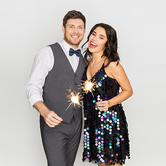 Image showing happy couple with sparklers at party