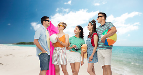 Image showing happy friends with beach and summer accessories