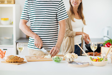 Image showing close up of couple cooking food at home