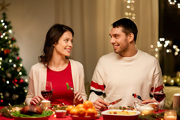 Image showing happy couple eating at christmas dinner