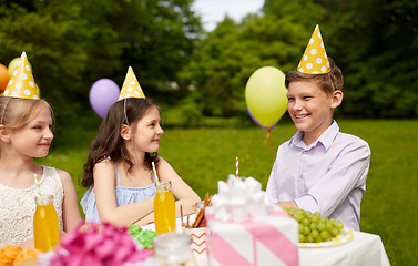 Image showing happy kids on birthday party at summer garden