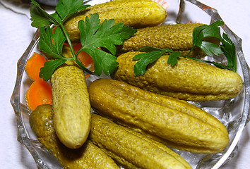 Image showing Dish with pickled cucumbers and parsley