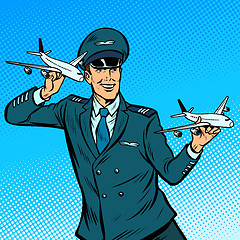 Image showing male airplane pilot. Model aircraft in hand