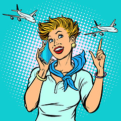 Image showing stewardess at the airport talking on the phone