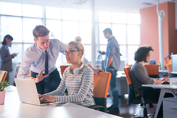 Image showing Two Business People Working With laptop in office